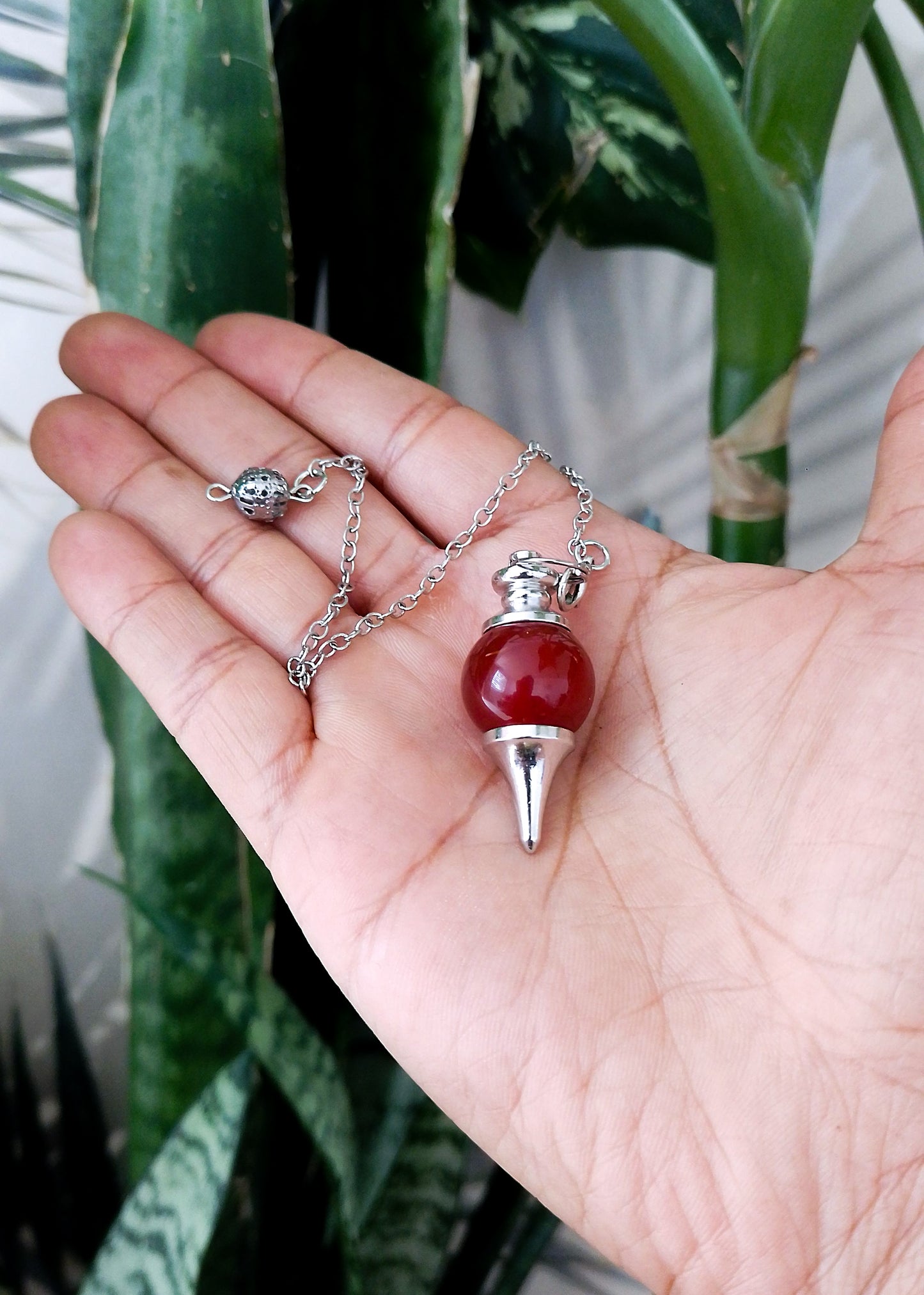 Péndulo de cuarzo rojo