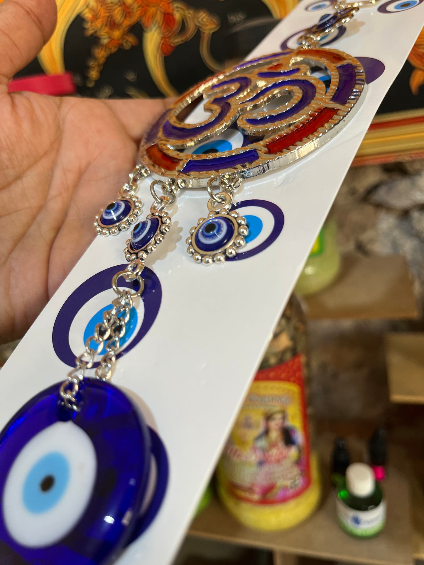 Colgante Om Tricolor en Acero con Ojo Turco - Símbolo de Protección y Armonía